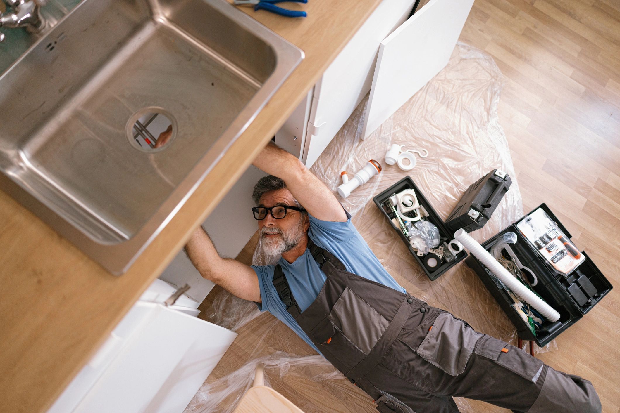 plumber fixing pipes